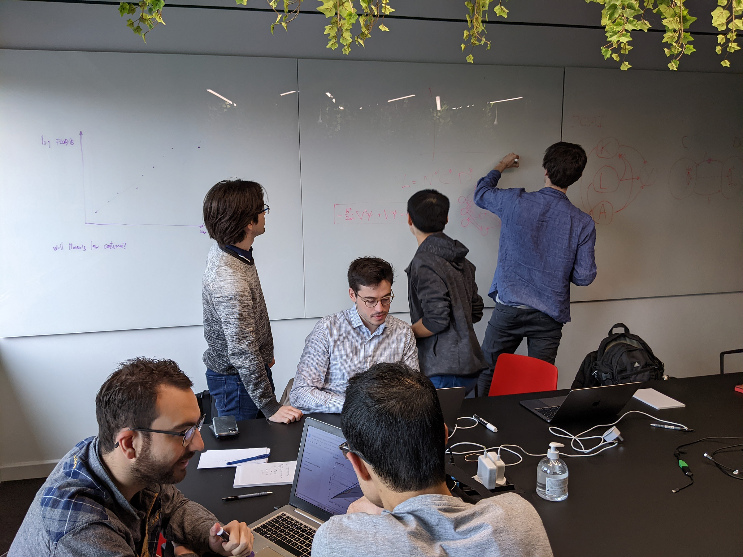 Sevilla, bottom left, together with members of the founding team in a meeting room at Epoch's first ward in April 2022. At this event members decided to create an organization and chose the name Epoch with the help of a Twitter poll.